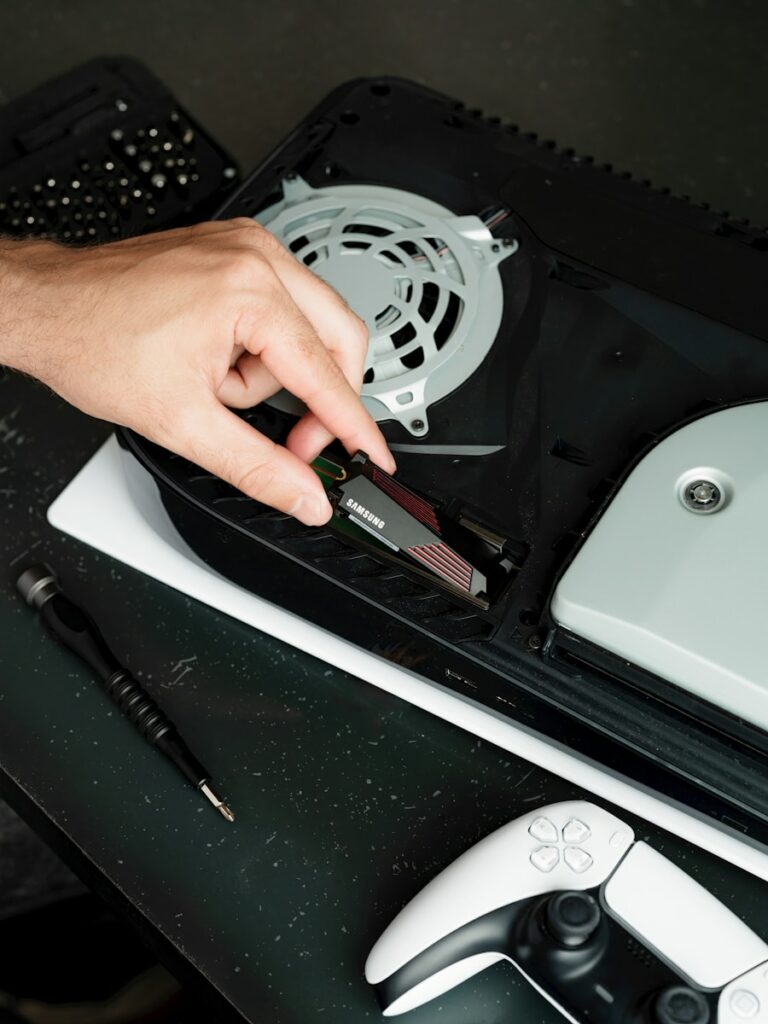 A person cutting a piece of plastic with a pair of scissors